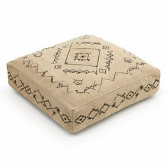 Natural beige square floor cushion with black tribal geometric print on white background