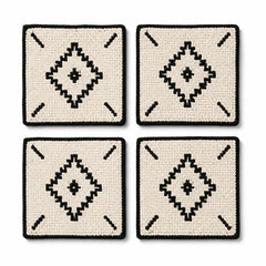 Natural black tufted geometric coaster set on a clean white background