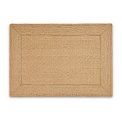 Natural braided jute border bath mat on white background