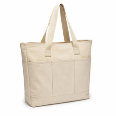 Natural canvas tote bag with divided front utility pockets and long handles on a white background.