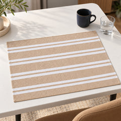 Natural beige rectangular placemat with alternating fine and broad ivory horizontal stripes on a clean white dining table