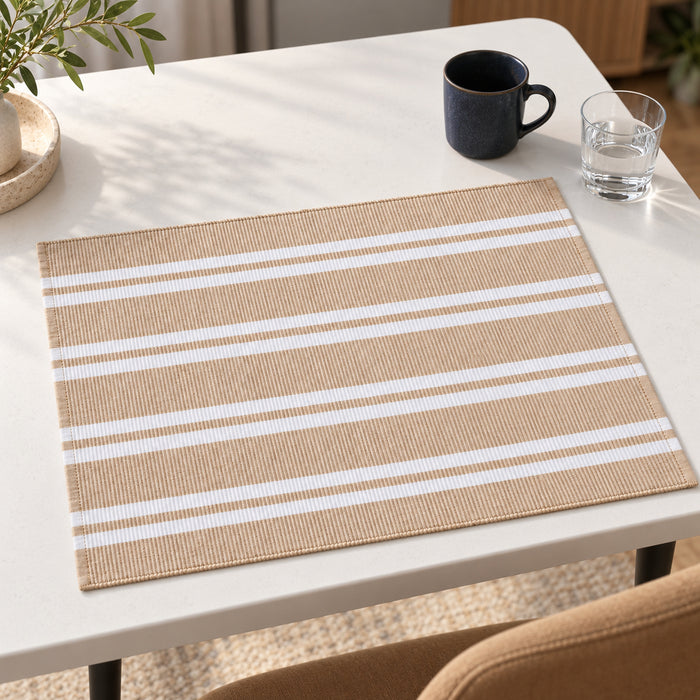 Natural beige rectangular placemat with alternating fine and broad ivory horizontal stripes on a clean white dining table