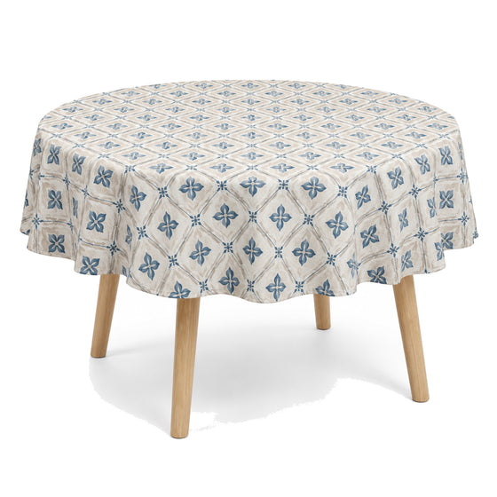 Primeval natural muted blue beige floral geometric tablecloth displayed on a round dining table