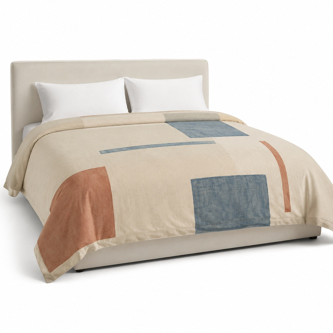 Primeval natural muted blue and rust abstract block duvet cover displayed on a styled bed against a clean white studio background