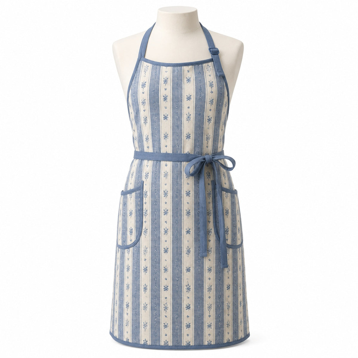 Primeval natural chef apron with muted blue stripe and floral details displayed on a dress form