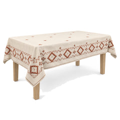 Primeval natural terracotta cream geometric embroidery tablecloth displayed on a rectangular dining table