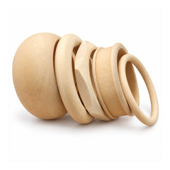 Assortment of smooth natural unfinished wooden bangle bracelets in varying thicknesses and rounded profiles