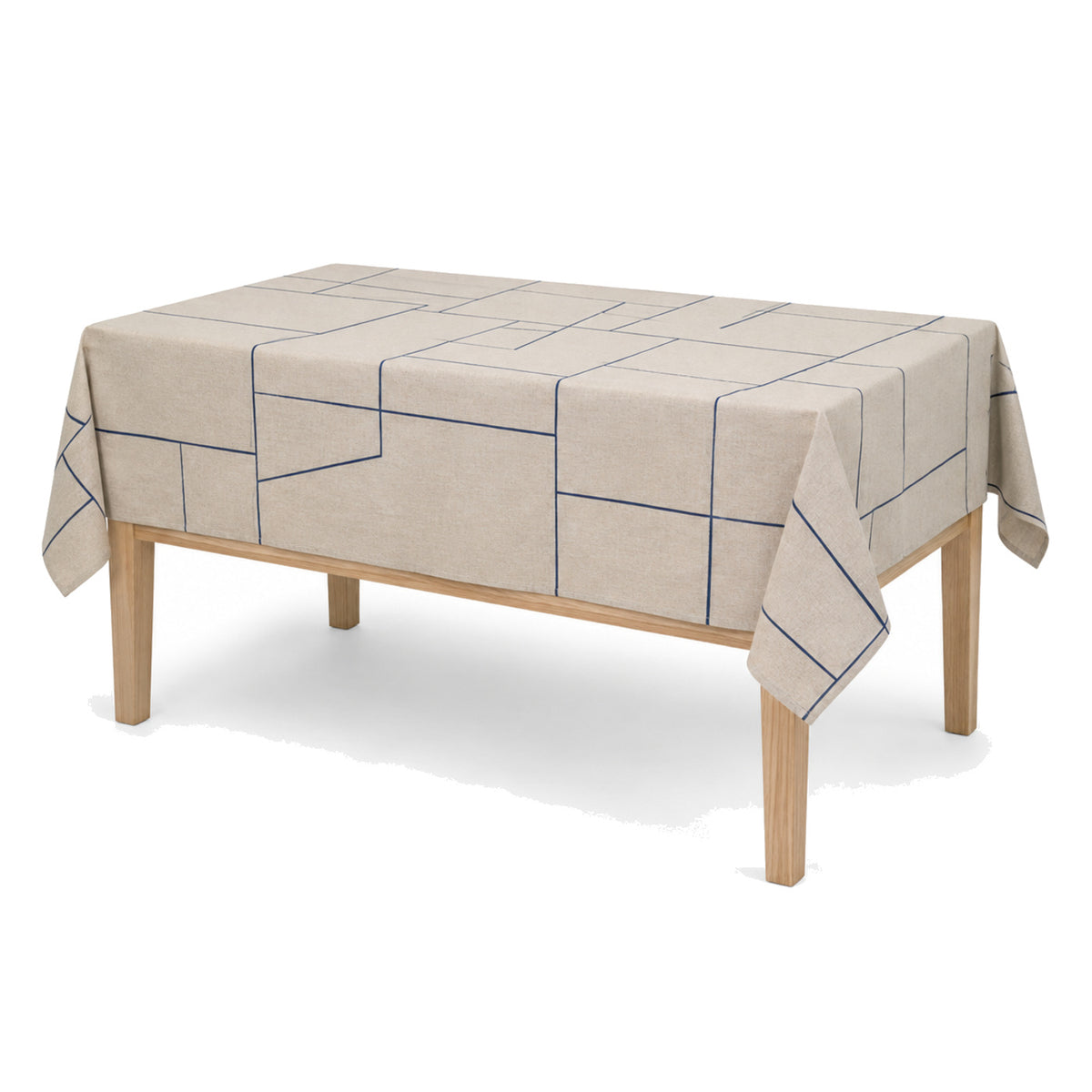 Primeval navy natural beige geometric tablecloth displayed on a rectangular dining table