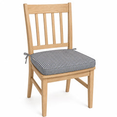 Primeval navy and white pinstripe dining chair pad with tie straps on wooden dining chair