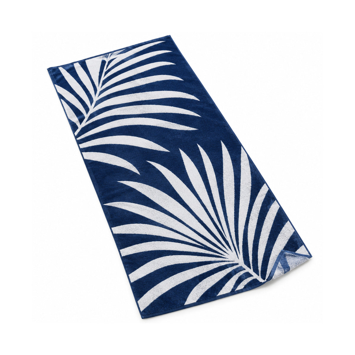 Navy and white beach towel with a tropical palm botanical pattern.
