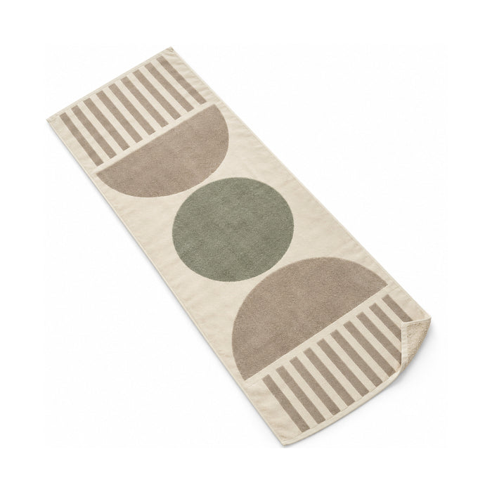 Neutral modern beach towel with a clean circle-based geometric pattern.