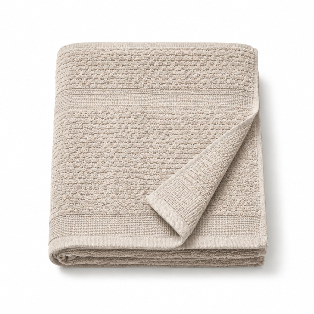 Neutral Scandinavian textured cotton bath towel 70x140 cm on white background