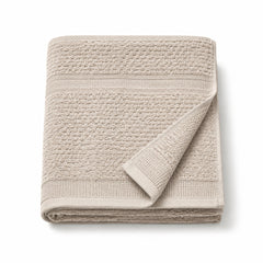 Neutral Scandinavian textured cotton bath towel 70x140 cm on white background