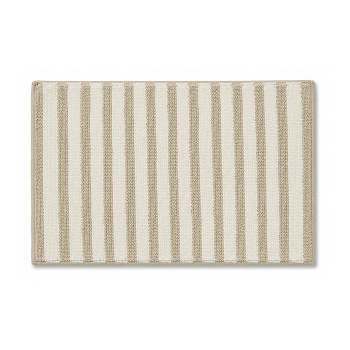 Neutral beige and ivory striped textured bath mat on white background