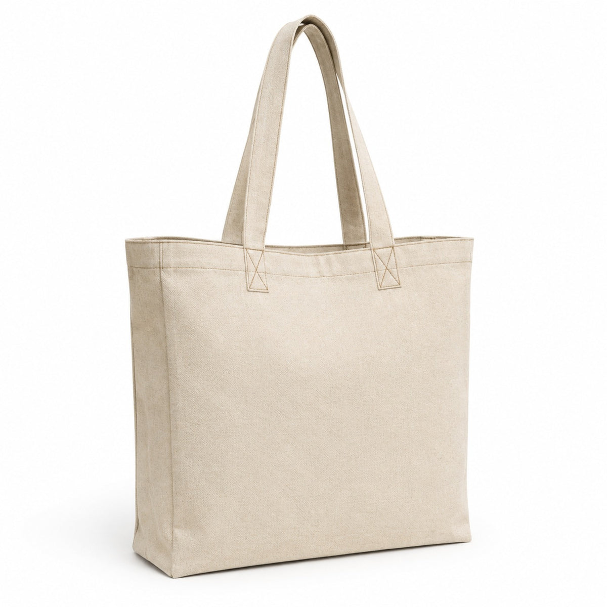 Oatmeal canvas tote bag with subtle contrast stitching and long handles on a white background.