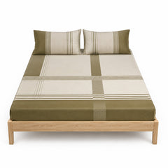 Olive and beige geometric stripe bed sheet set with matching pillowcases on a wooden bed