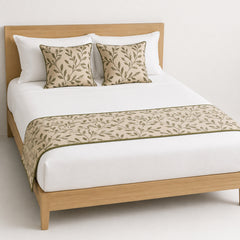 Olive vine botanical bed runner styled on white bedding for wholesale resort, boutique hotel and private-label sourcing
