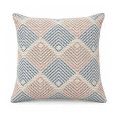 Primeval pastel blush pink and powder blue cushion cover featuring repeating diamond and chevron geometric motifs