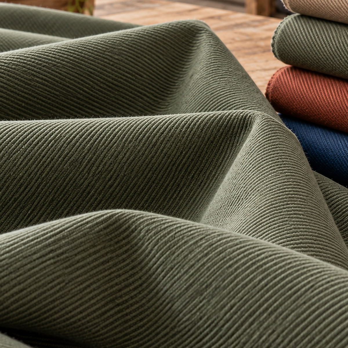 Heavy cotton twill featuring pronounced diagonal ribs in beige and coordinating colours; Primeval fabric sourcing reference PML-FAB-011