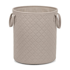 Quilted greige cotton laundry basket on a clean white background