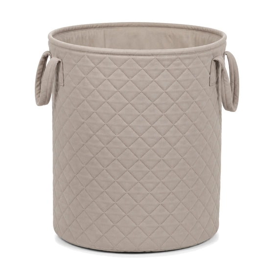 Quilted greige cotton laundry basket on a clean white background