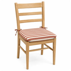 Primeval rust and cream bold striped dining chair pad with tie straps on wooden dining chair
