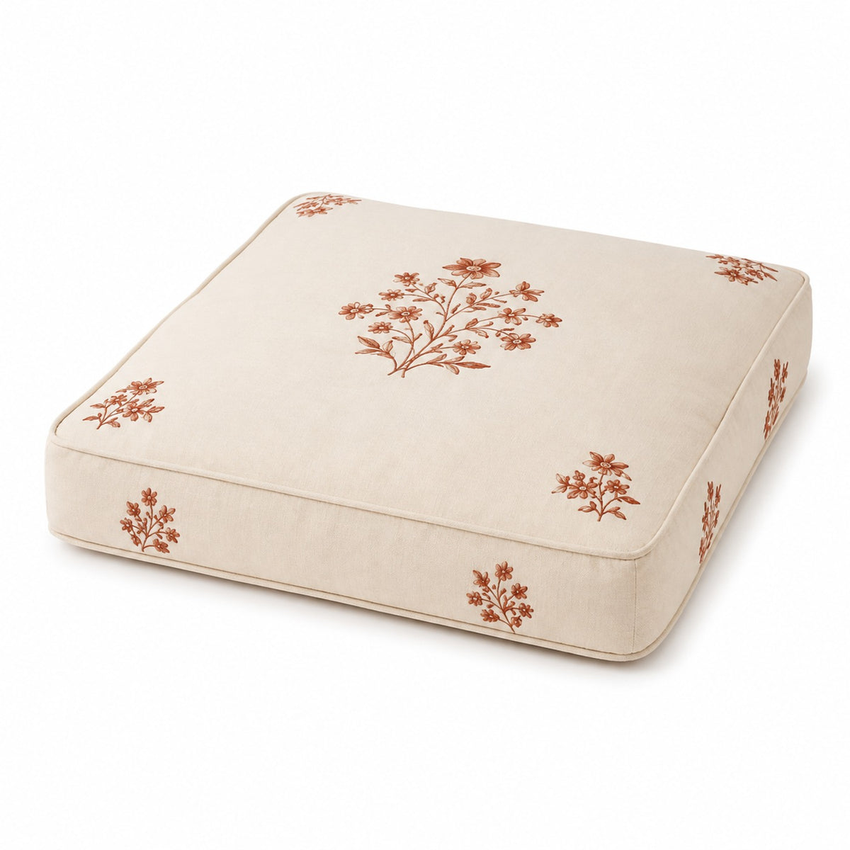 Ivory square floor cushion with rust floral block-style print on white background