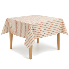 Primeval rust ivory broken stripe tablecloth displayed on a square dining table