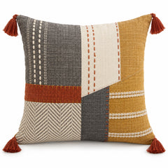 Rust mustard grey and ivory decorative cushion with patchwork design and corner tassels