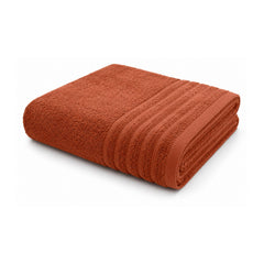 Rust terracotta ribbed towel for warm modern bathroom and retail collections