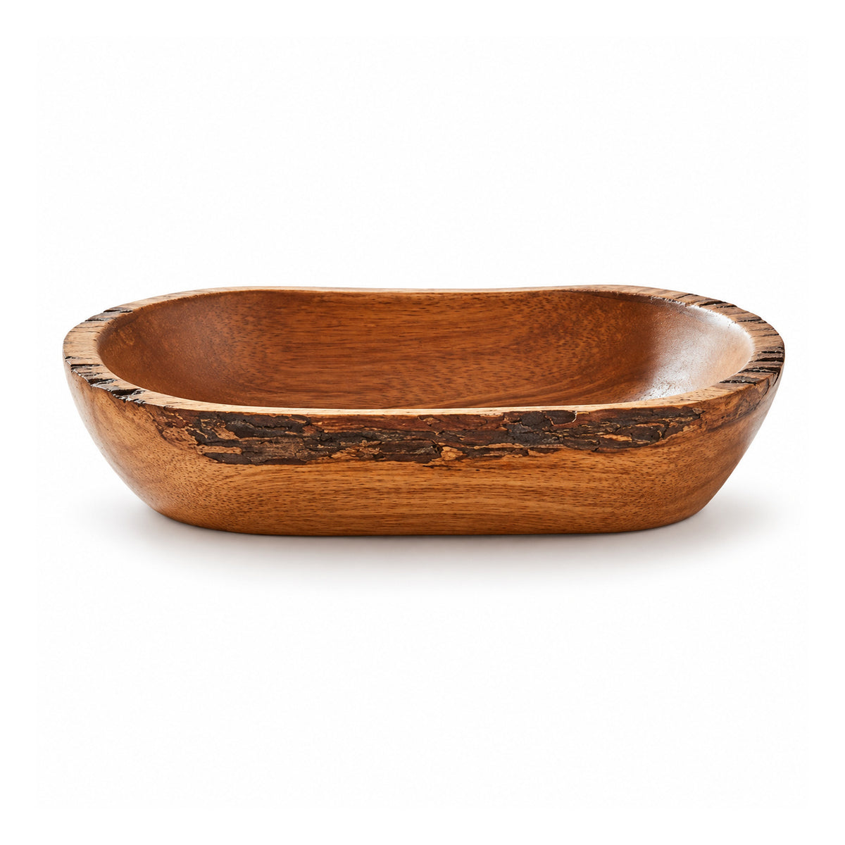 Low oval wooden bowl with warm brown grain, irregular bark-style live-edge rim and smoothly hollowed interior