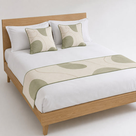Sage abstract circle bed runner styled on white bedding for wholesale contemporary hotel, resort and private-label sourcing
