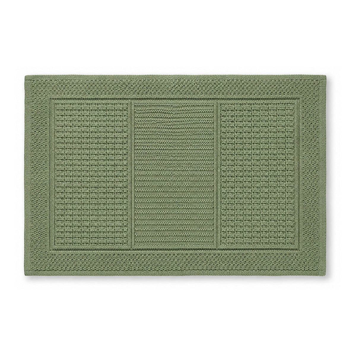 Sage green textured bath mat with framed woven panel design on white background