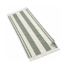 Sage green and white striped fringed beach towel on a white background.
