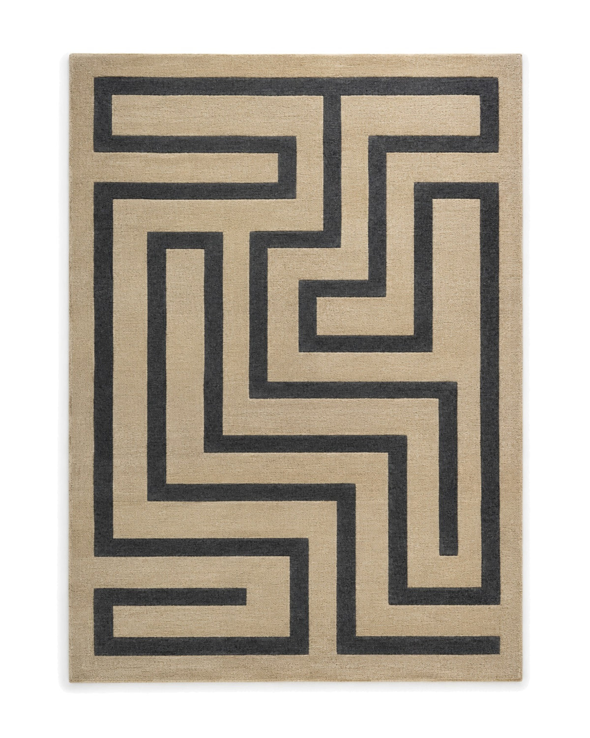 Sand and charcoal cut-pile area rug with a bold angular maze pattern on a white background.