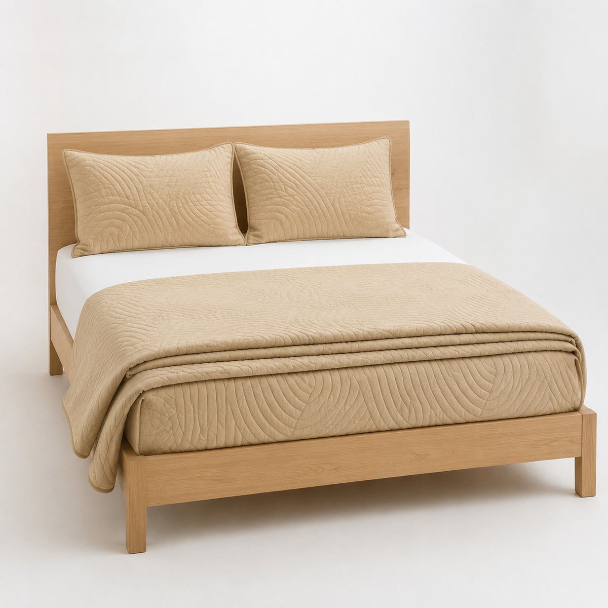 Sand curved-line quilted cotton quilt, folded with matching pillows for wholesale bedding sourcing