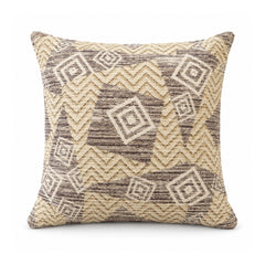 Primeval sand beige and taupe cushion cover with tribal-inspired chevrons and diamond-shaped geometric motifs