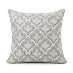 Primeval silver grey and ivory cushion with a repeating Moroccan-inspired quatrefoil trellis motif, shown on a clean white background