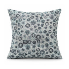 Primeval steel blue and soft grey cushion with irregular charcoal leopard-inspired spots