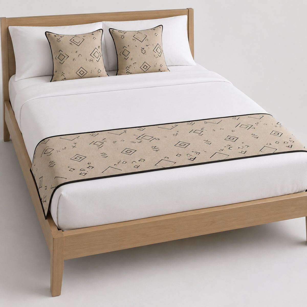 Taupe bed runner with small floral motif, styled on white bedding for wholesale hotel, boutique and private-label bedroom sourcing
