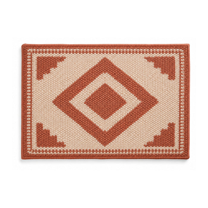 Terracotta and ivory geometric diamond bath mat on white background