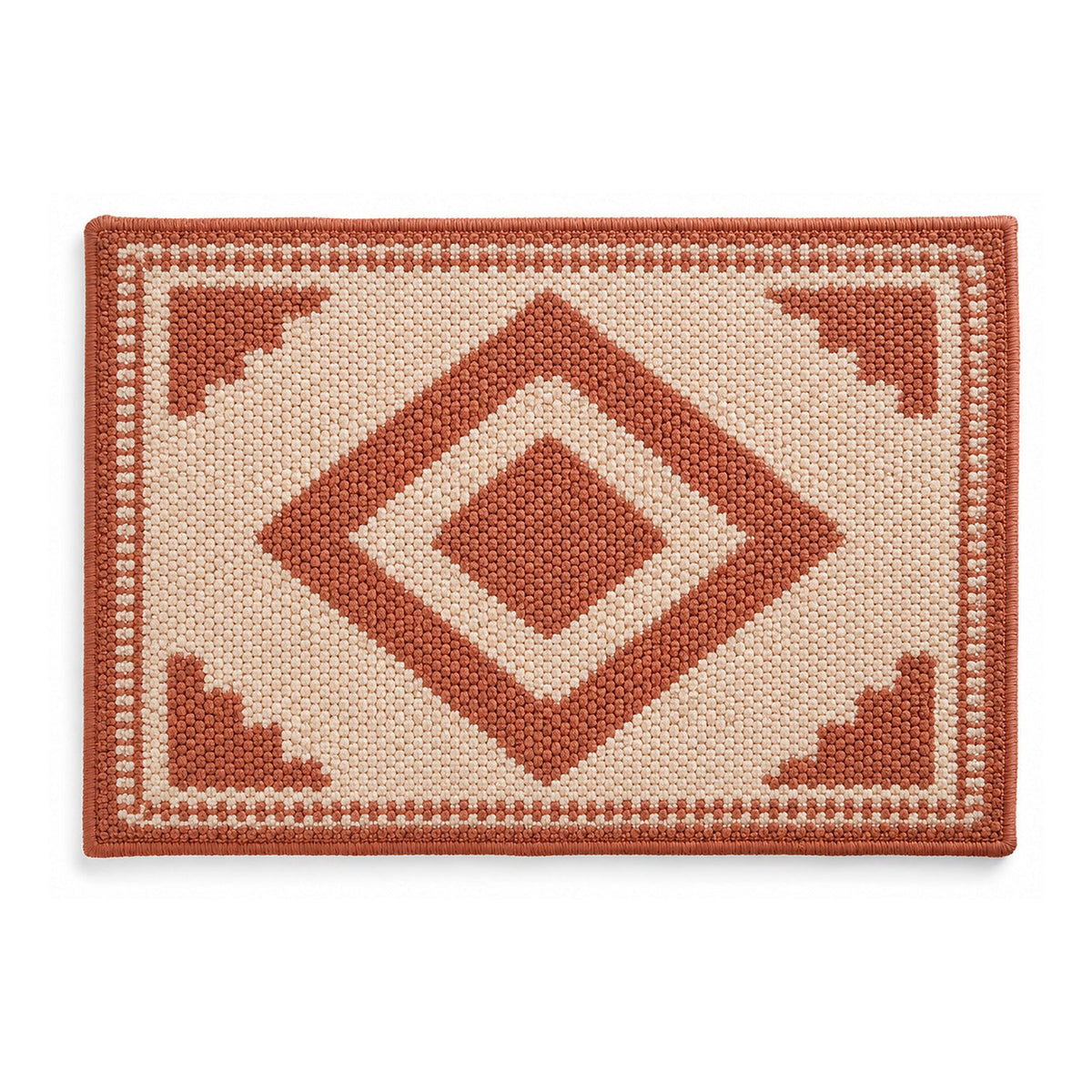 Terracotta and ivory geometric diamond bath mat on white background