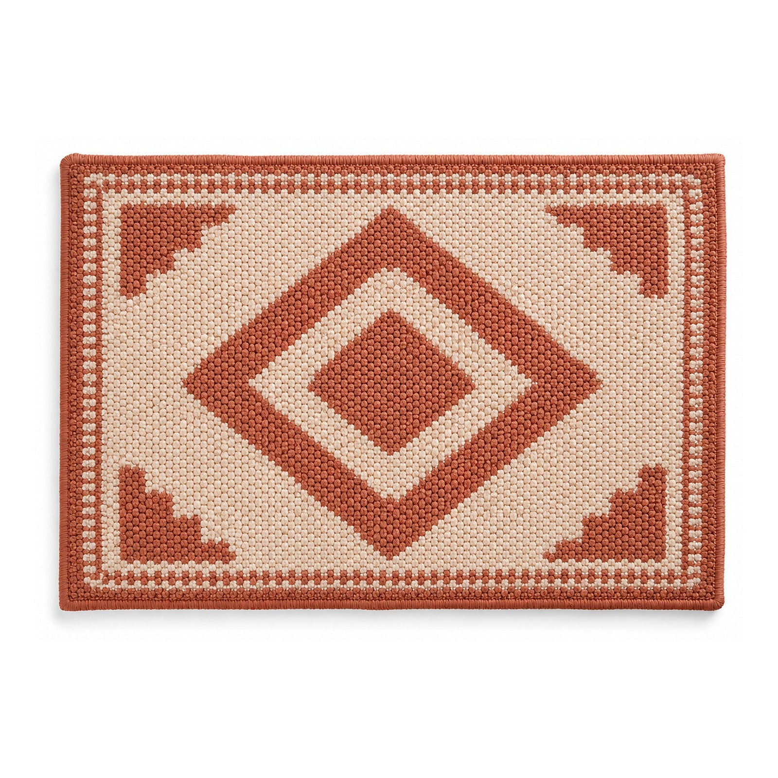 Terracotta and ivory geometric diamond bath mat on white background