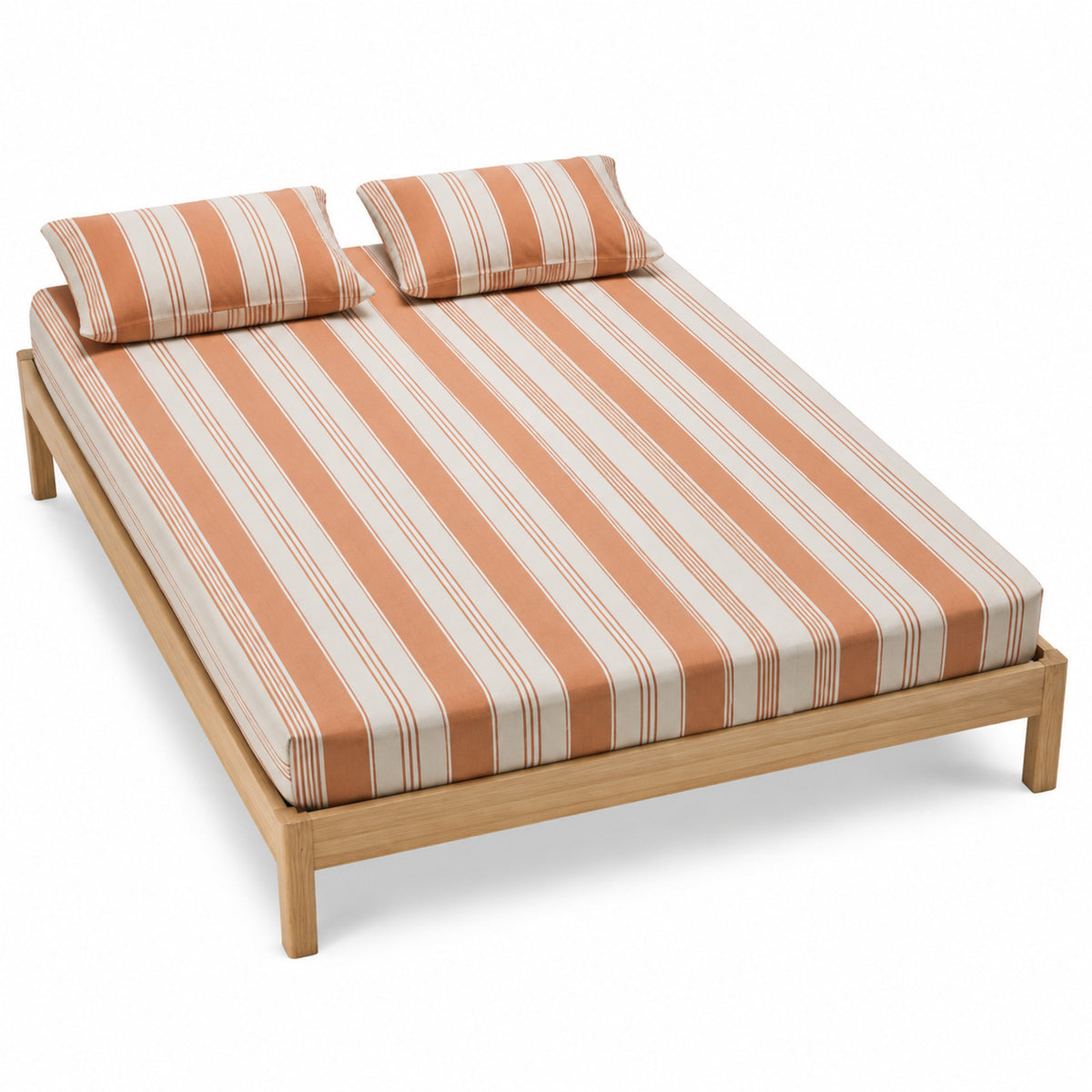 Terracotta and natural stripe bed sheet set with matching pillowcases on a wooden bed