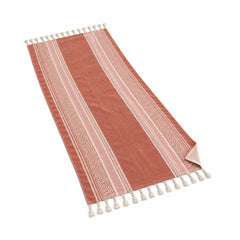 Terracotta fringed beach towel with an ornamental border pattern.
