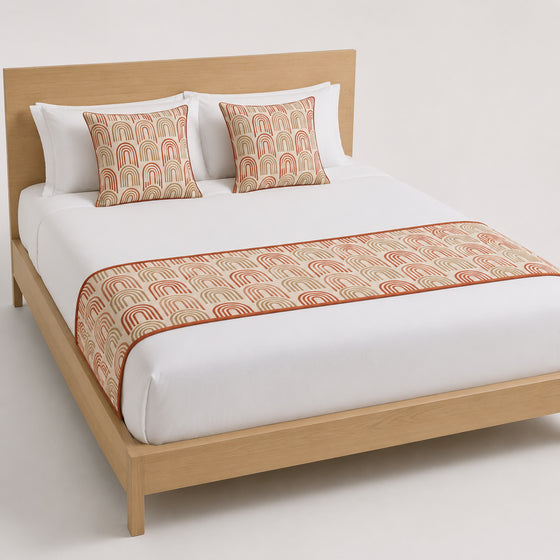 Terracotta paisley floral bed runner styled on white bedding for wholesale boutique hotel, resort and private-label bedroom sourcing