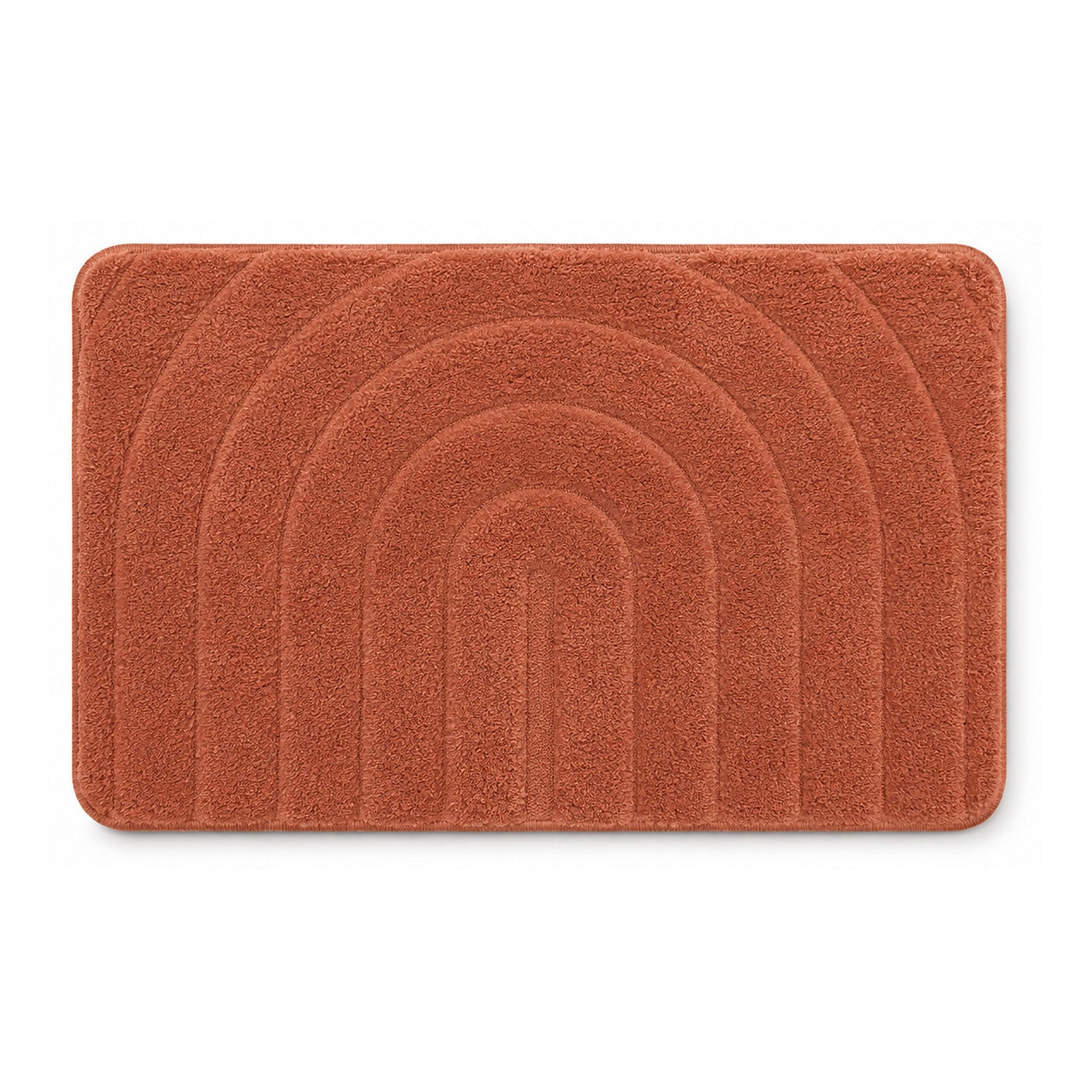 Terracotta rainbow arch tufted bath mat on white background
