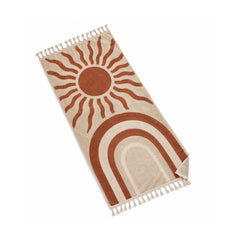 Ivory fringed beach towel with terracotta sun and rainbow motifs.