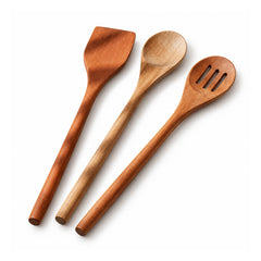 Three wooden cooking utensils, a flat spatula, round spoon and slotted spatula, in contrasting natural brown tones