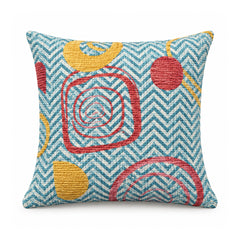 Primeval turquoise cushion cover with textured-looking zigzag lines and coral and ochre circular geometric motifs